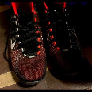 Nike orange and black shoes 10.5